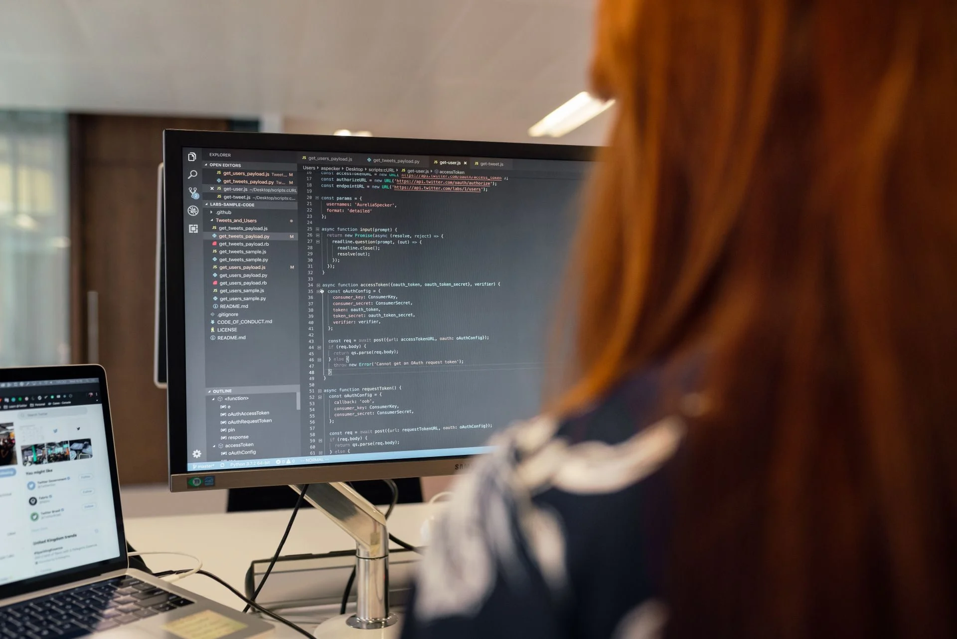A developer working on code at a monitor