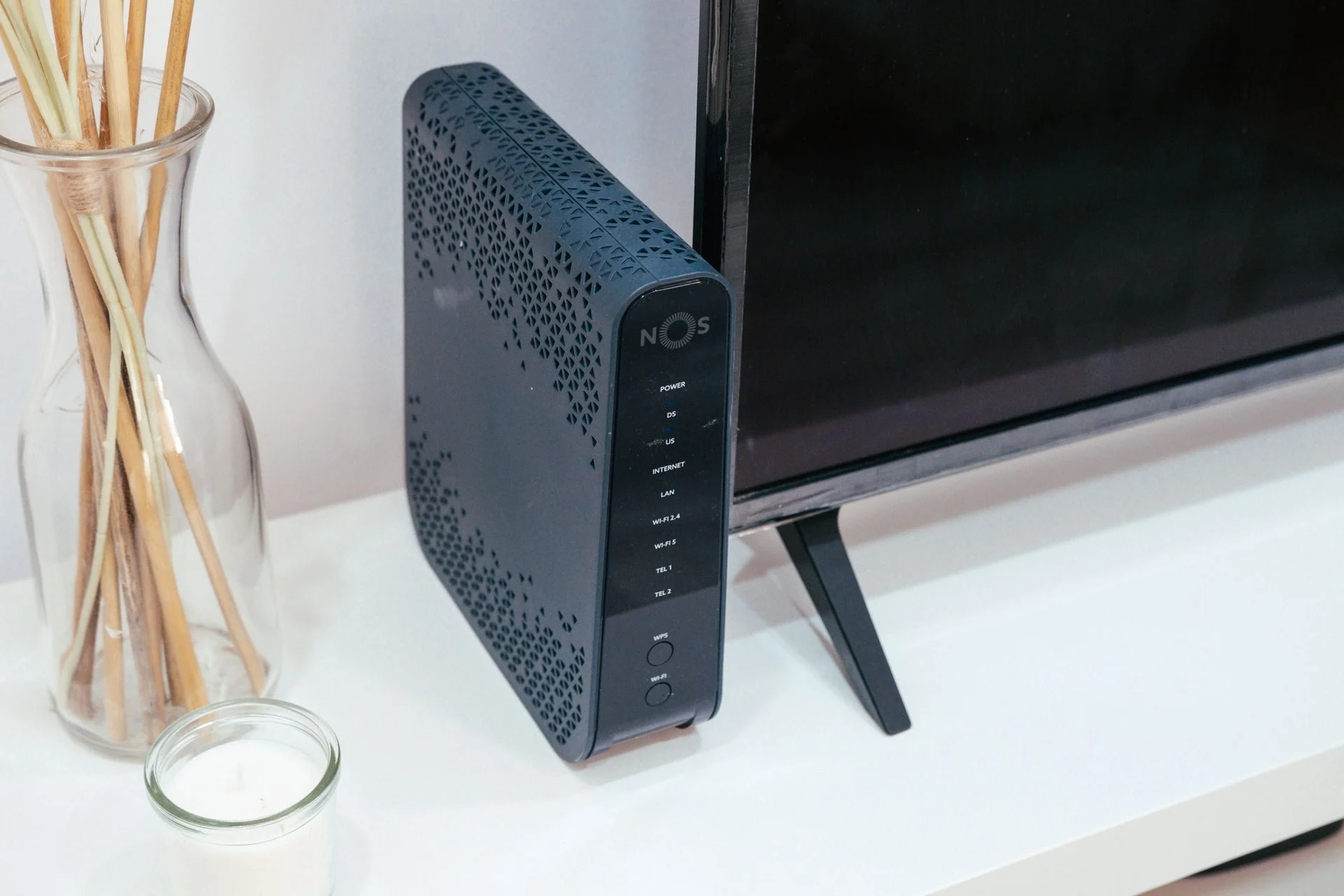 A wireless router on a shelf